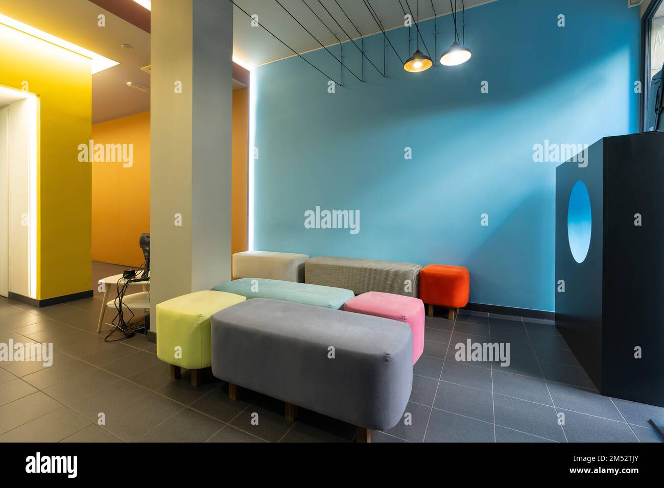 The Waiting room of a modern dental clinic with colored sofas Stock