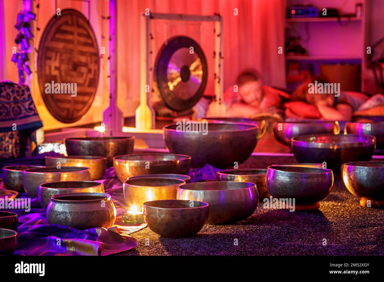 singing bowls lit by candlelight Stock Photo Alamy