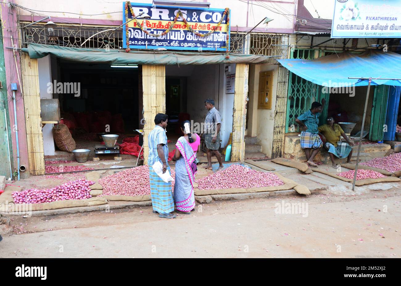 An Onion vendor in the market in Madurai, India. Stock Photo