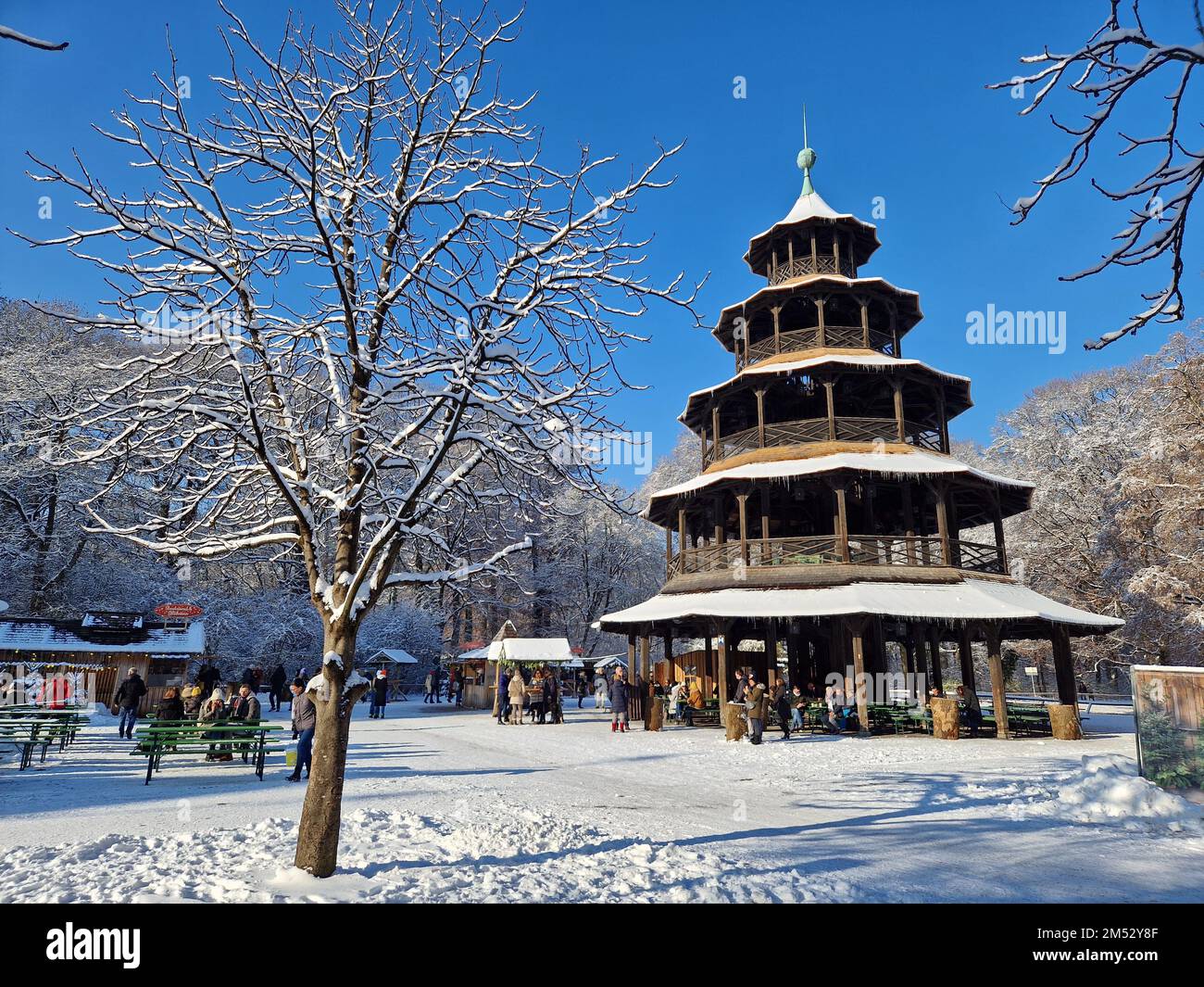 Christmas markets in the snow at Chinesischer Turm in Munich, Germany Stock Photo