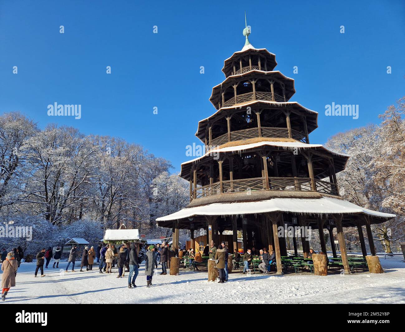Christmas markets in the snow at Chinesischer Turm in Munich, Germany Stock Photo