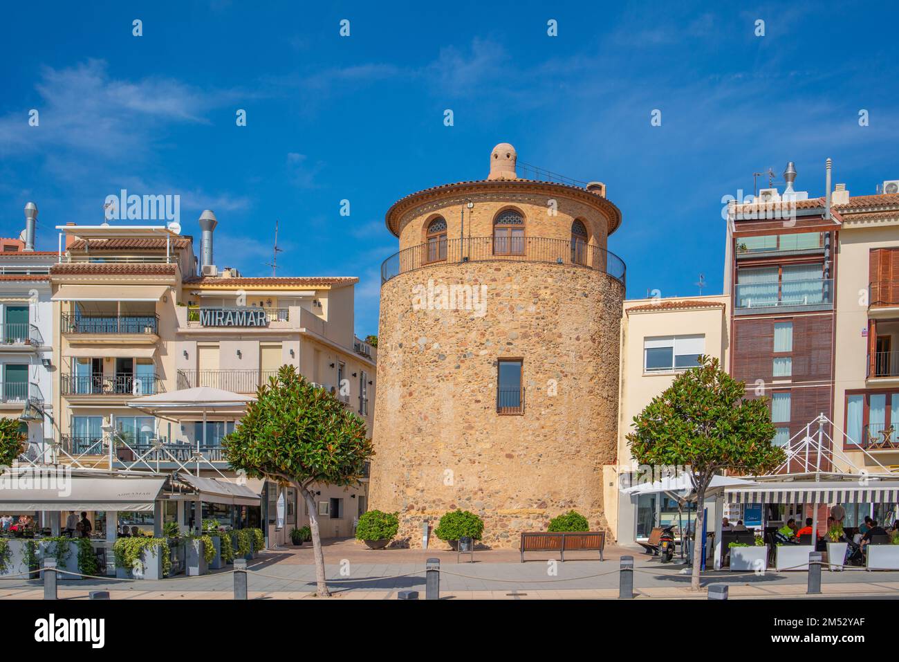 CAMBRILS, SPAIN-OCTOBER 13 2022: View of Cambrils Port and city waterfront with Church Of Saint Peter in middle and Torre del Port. Stock Photo