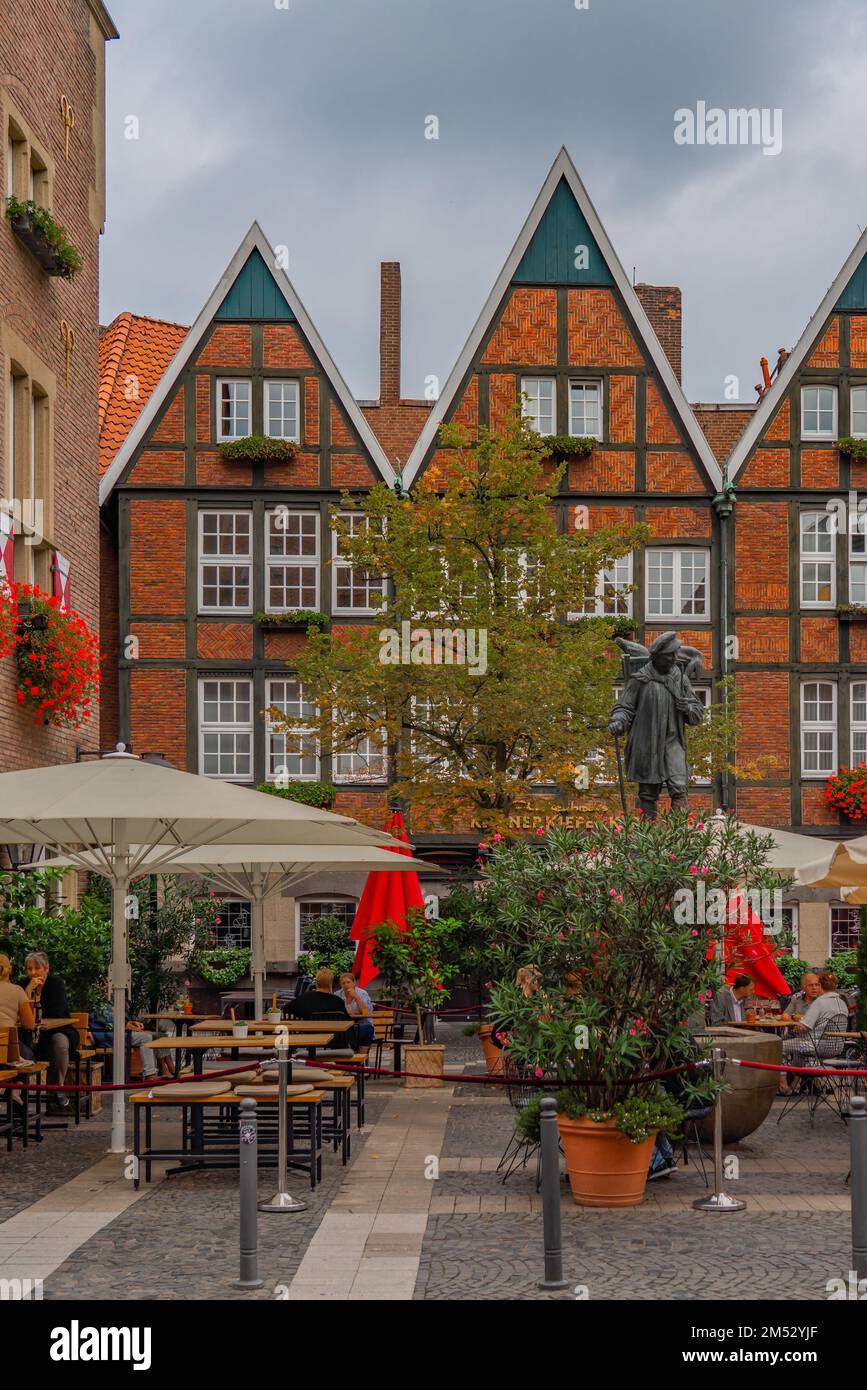 Muenster, Germany - September 13.2022: The old town and pedestrian zone of Muenster with the Kiepenkerl sculpture Stock Photo