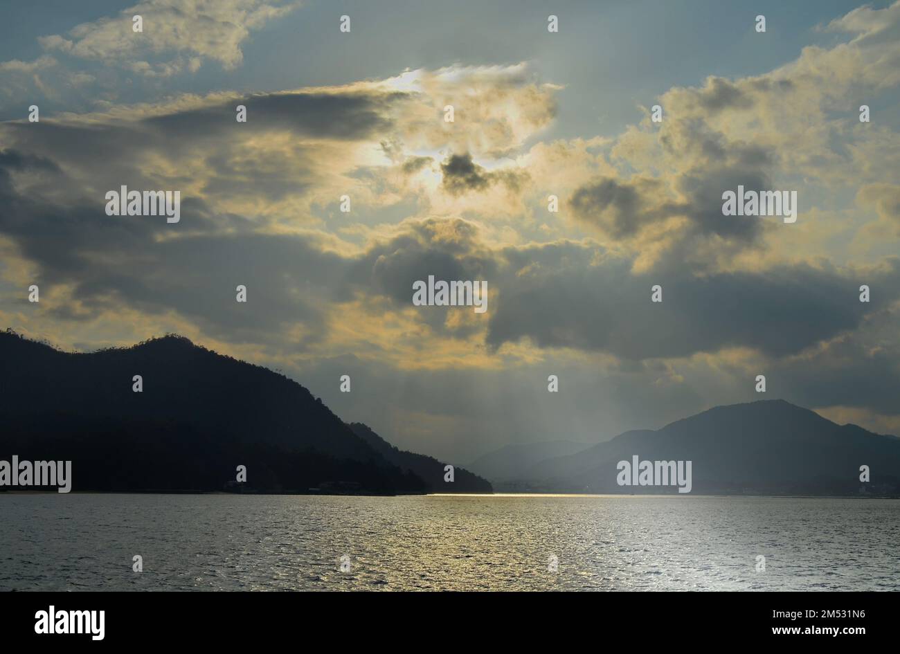 Sunset at Hiroshima Bay, Seto Inland Sea, between Itsukushima island and Hatsukaichi city. Hiroshima Prefecture, Japan. Stock Photo