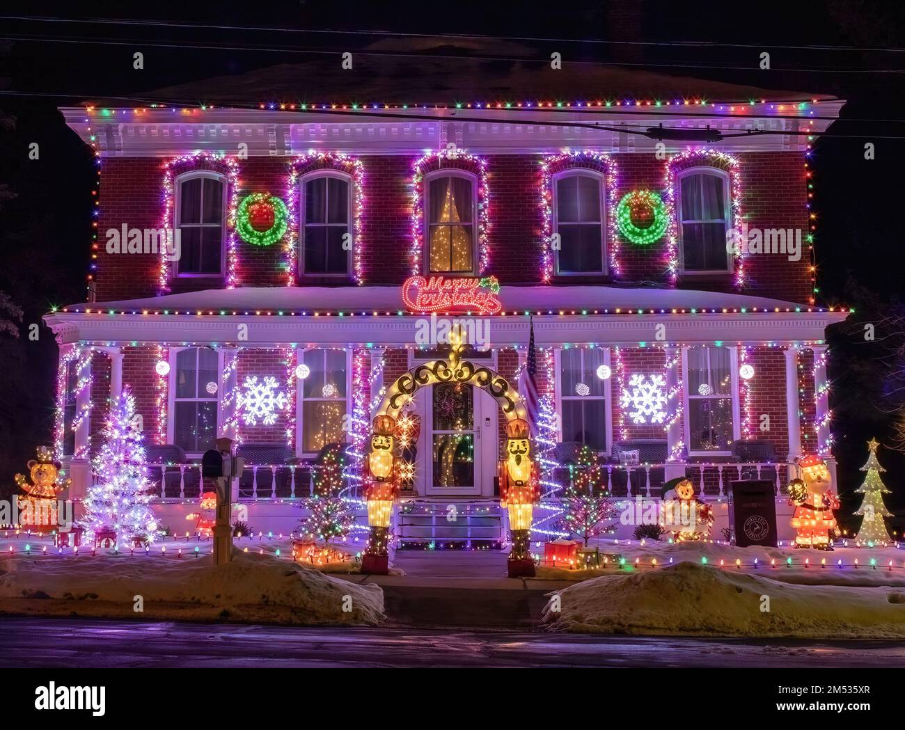 Beautiful Christmas house lighting with Christmas trees, toys