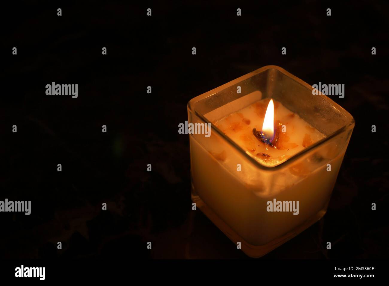 color candles slowly burning down in dark Stock Photo Alamy