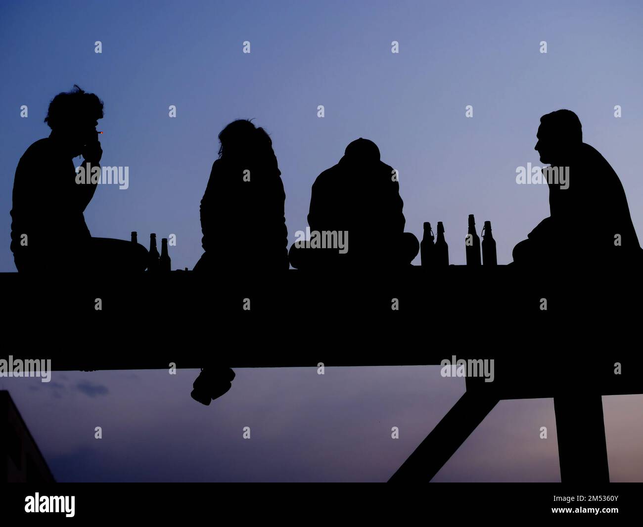 Silhouette of four friend Stock Photo - Alamy