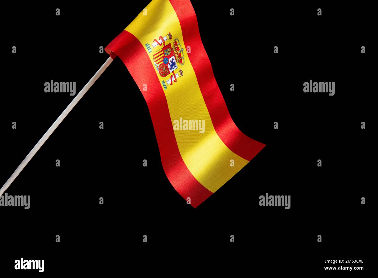 The Spanish flag on a black background developing and fluttering in the