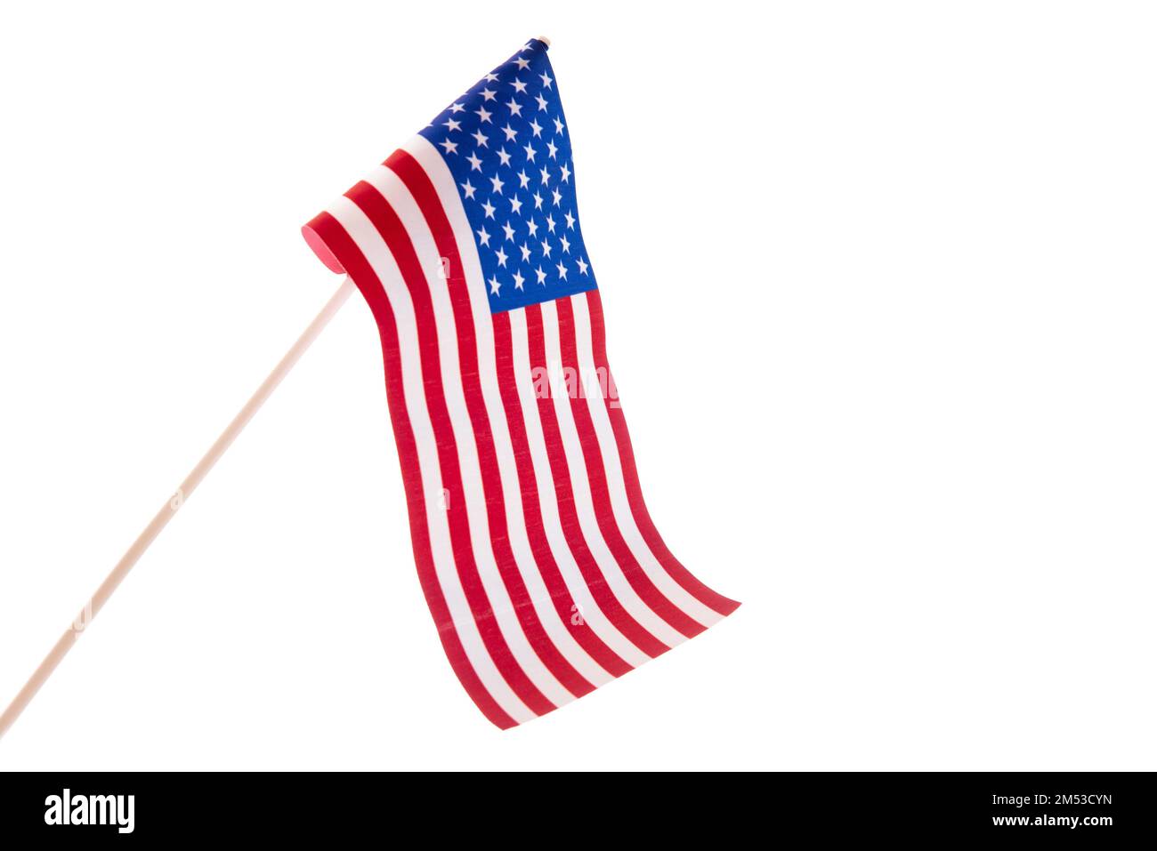 The USA flag is developing in the wind against a white background. Isolate Stock Photo