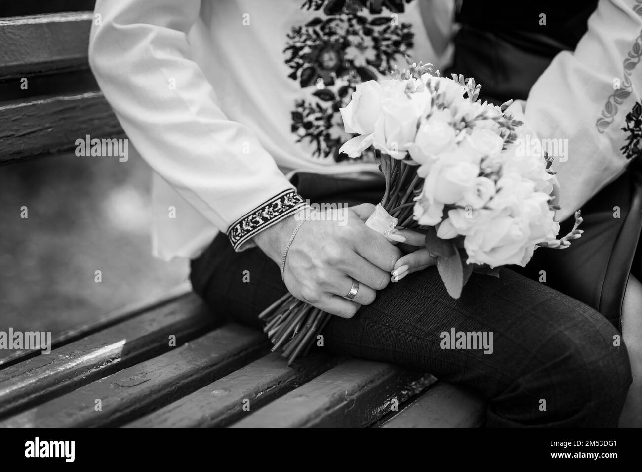 A bouquet of flowers in the hands of the bride. A bouquet of white flowers in the hands of a woman Stock Photo