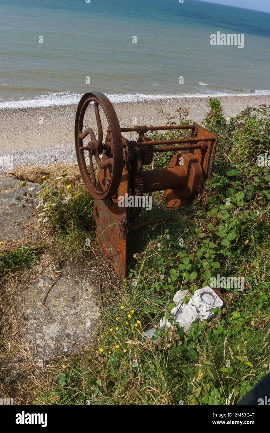 rusty old winch on the beach at the french coast of the north sea with