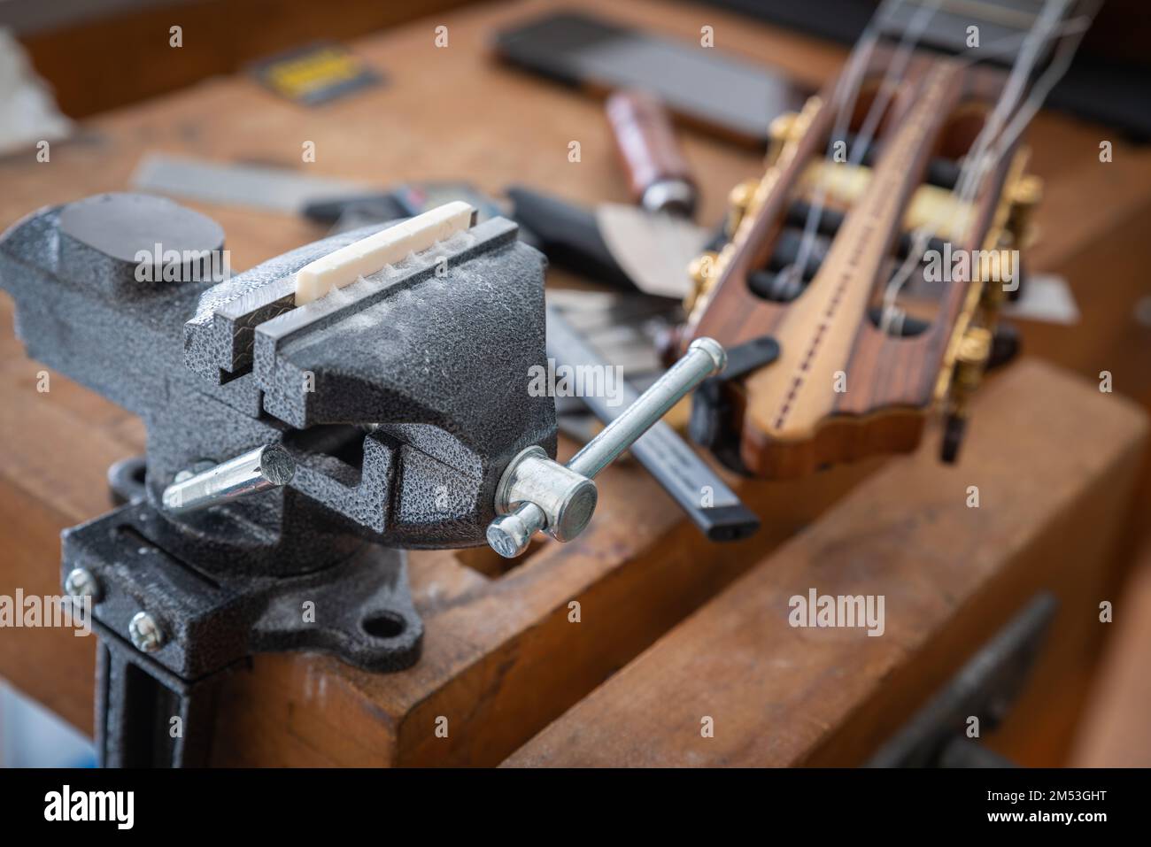 Musical instrument guitar repair and service guitar bone nut slotting