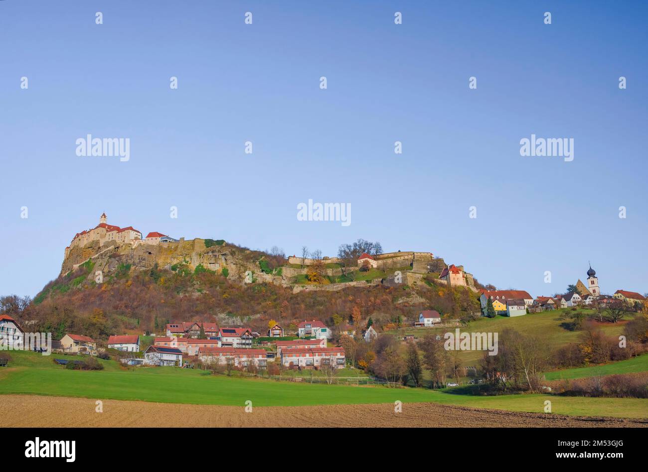 The medieval Riegersburg Castle on top of a dormant volcano, surrounded by charming little village and beautiful autumn landscape, famous tourist attr Stock Photo