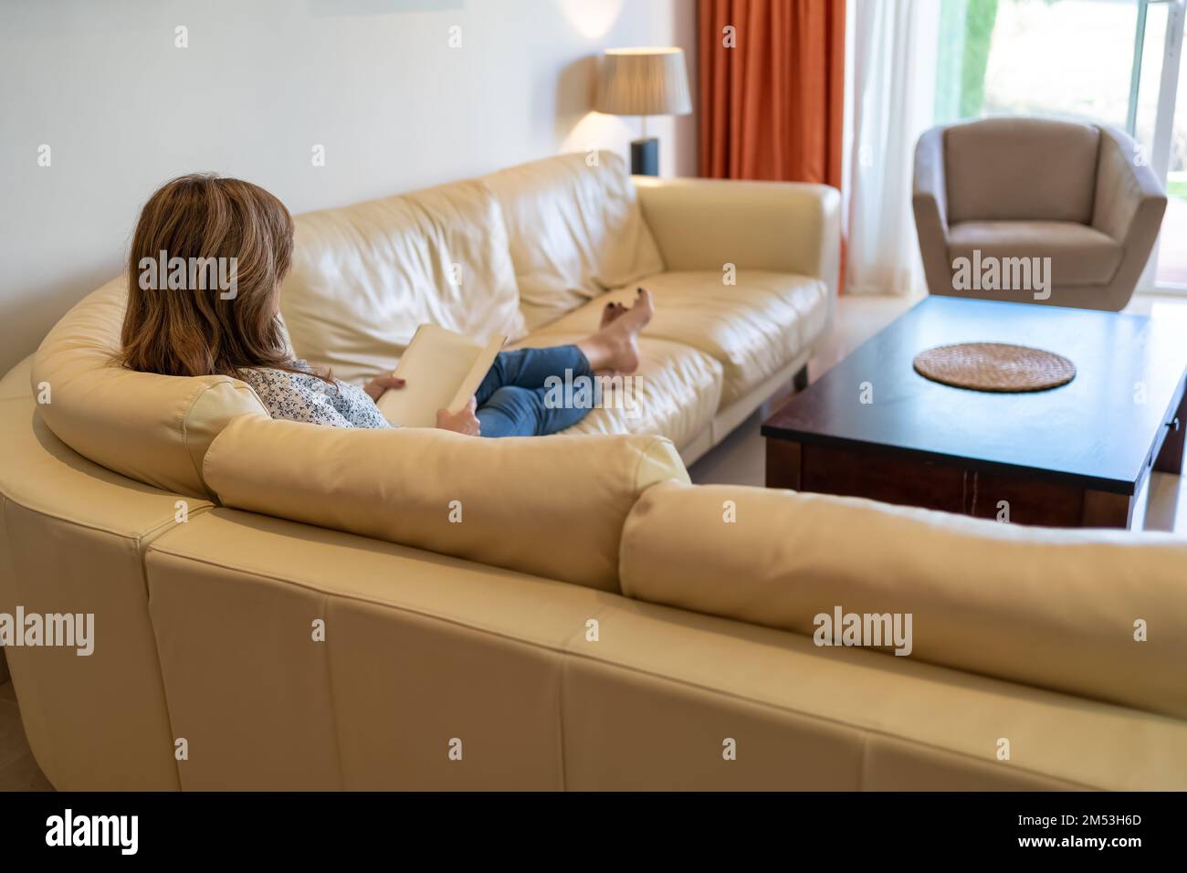 Older woman relaxing sofa hi-res stock photography and images - Alamy