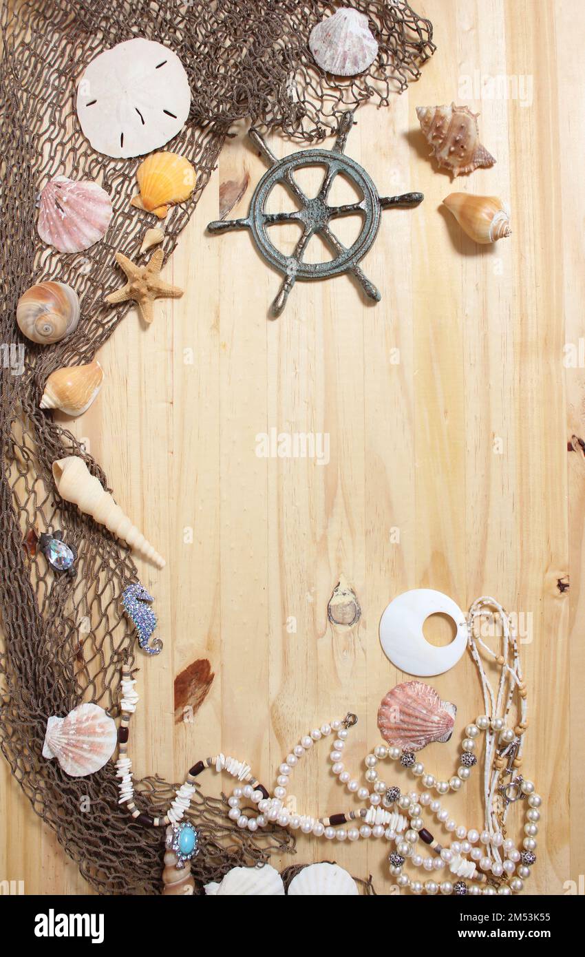 A top view of the Captains Wheel With Fishing Net and Sea Shells on