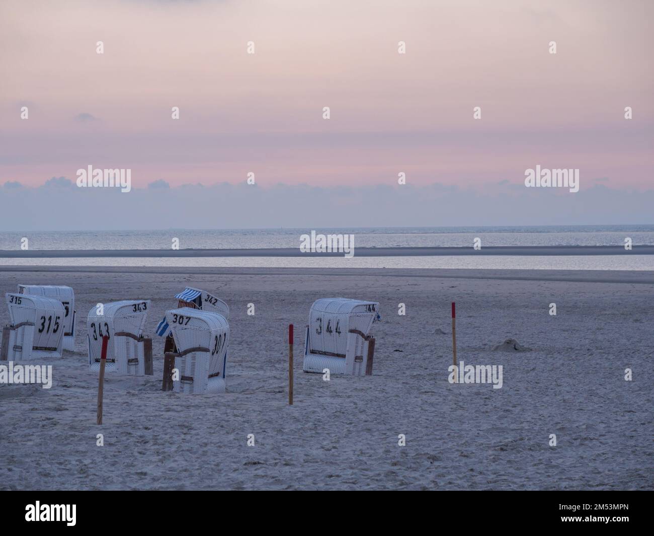 The island of Spiekeroog in the German north sea with its sandy beach ...