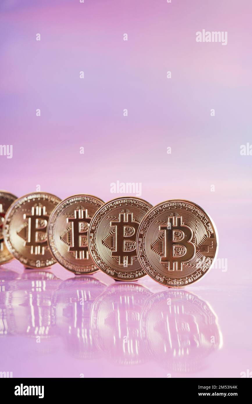 Golden bitcoin coins on holographic, abstract, neon background. digital currency, business style. Mining and trade bitcoin concept. selective focus Stock Photo