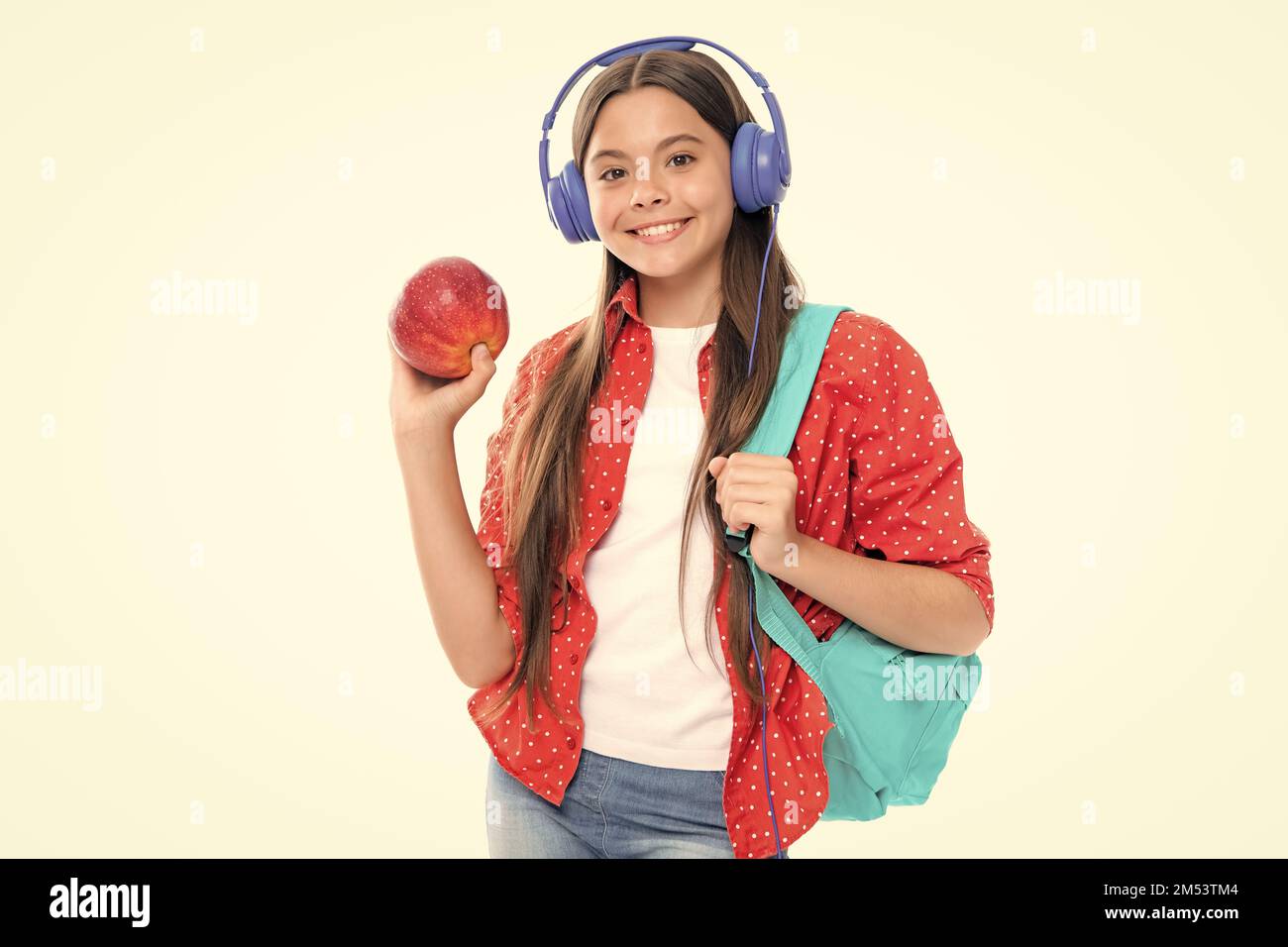 Back to school. Schoolgirl student in headphones with school bag ...