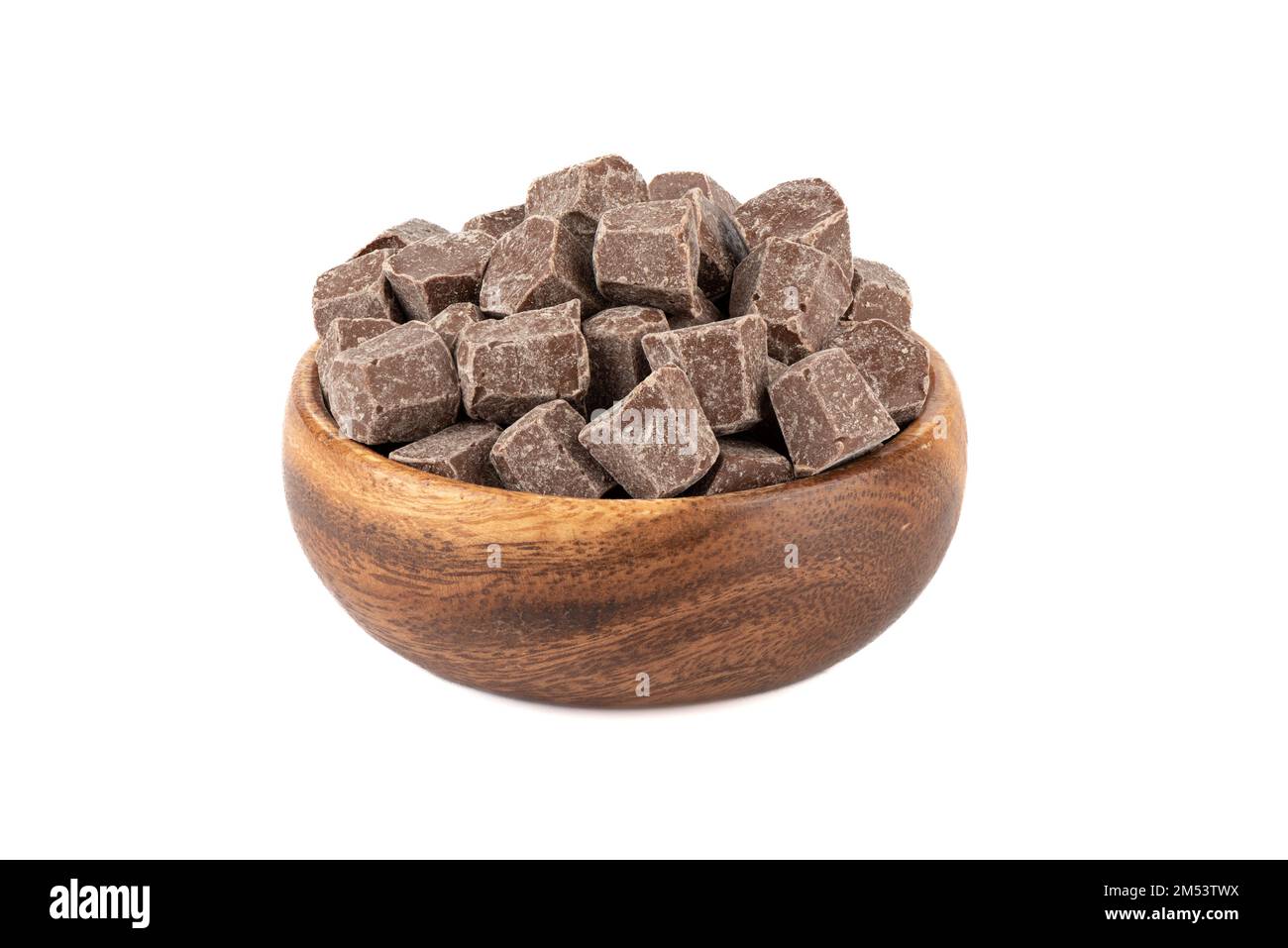 Diamond shaped chocolate in a wooden bowl over white background. Copy