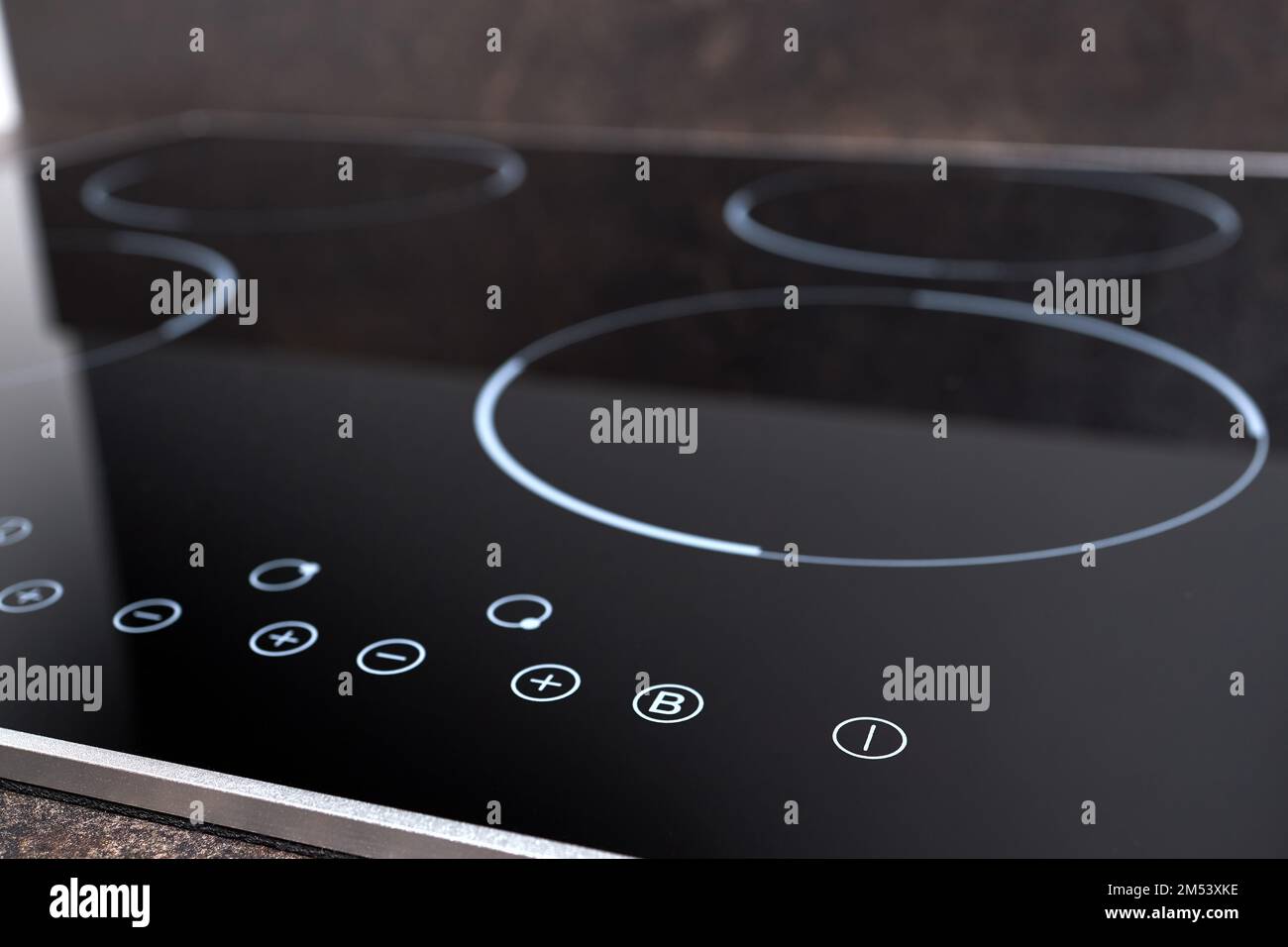 Modern induction electric hob cooker with control panel buttons