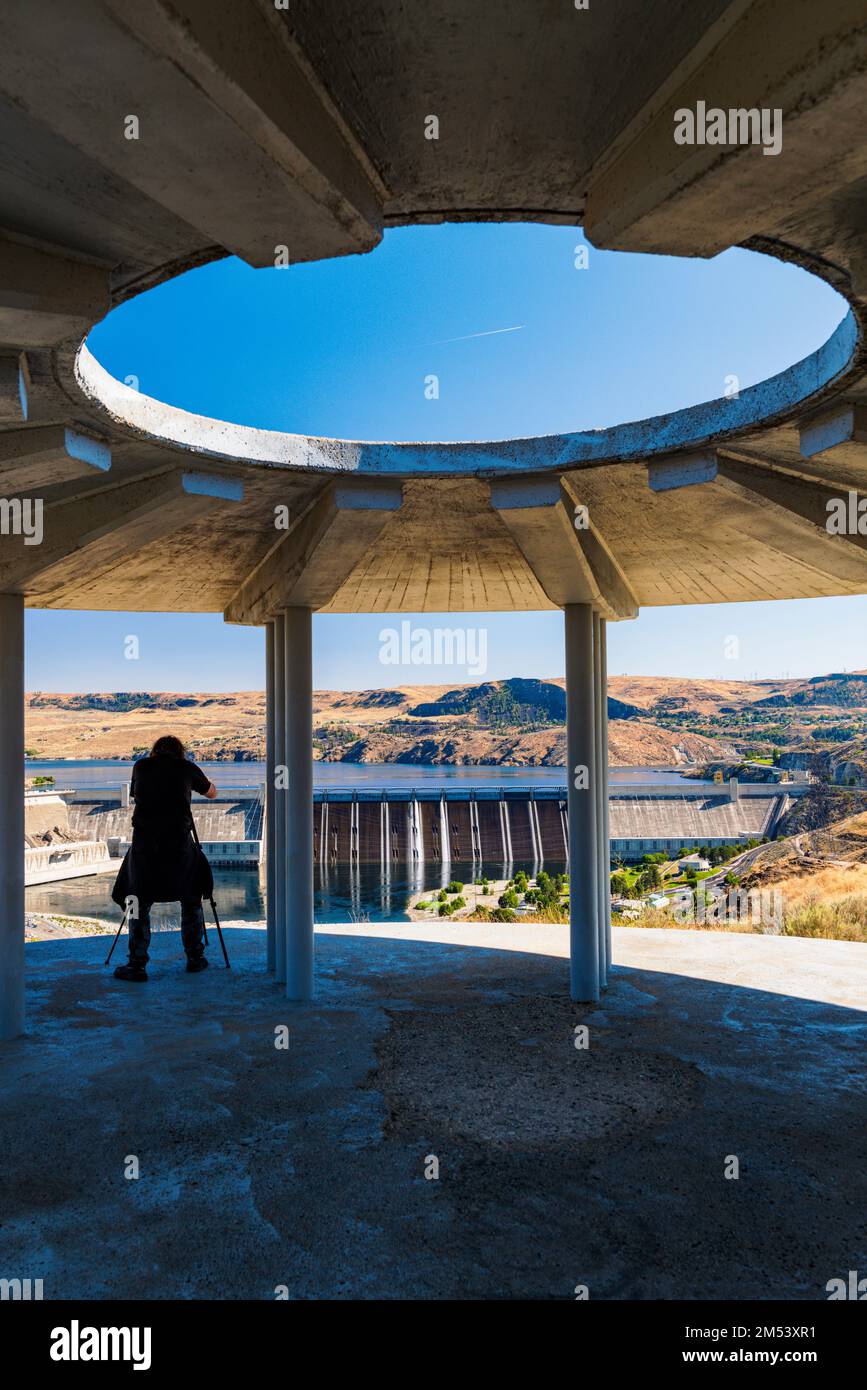 Visitor photographing Grand Coulee hydroelectric dam; largest producer of power in the USA; Columbia River; Washington state; USA Stock Photo