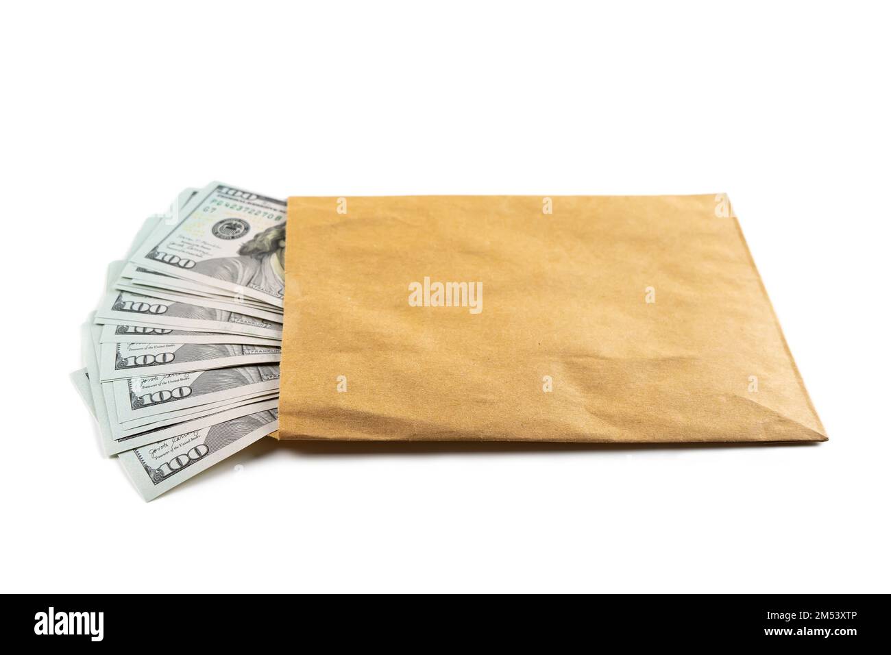 Pile of new design US dollar bills in brown envelope isolated on white background. Hundreds of dollar cash banknotes. Top view, flat lay. Business, fi Stock Photo