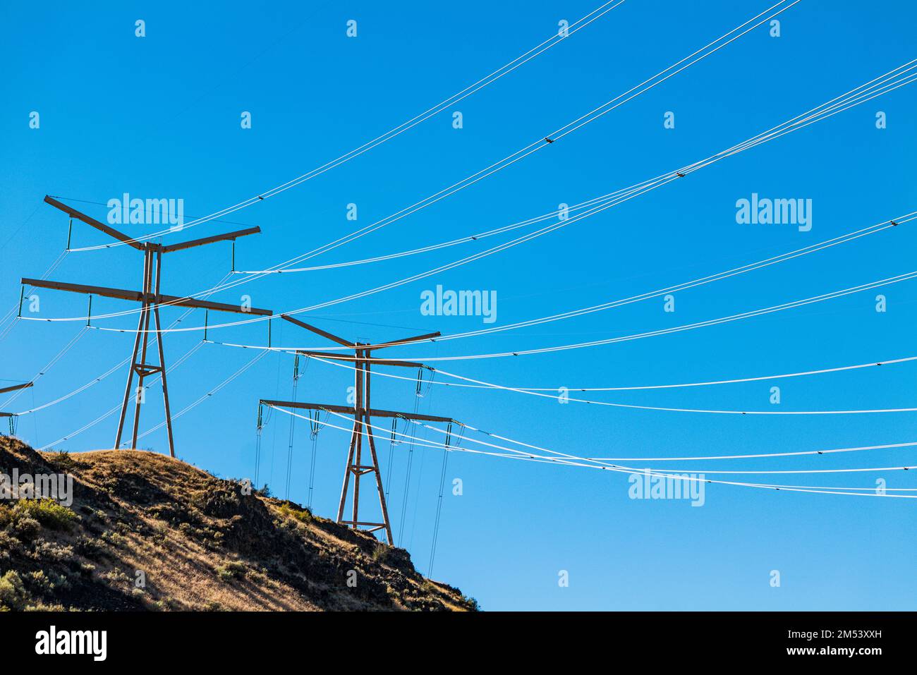 Electrical transmission lines run from Grand Coulee hydroelectric dam; largest producer of power in the USA; Columbia River; Washington state; USA Stock Photo