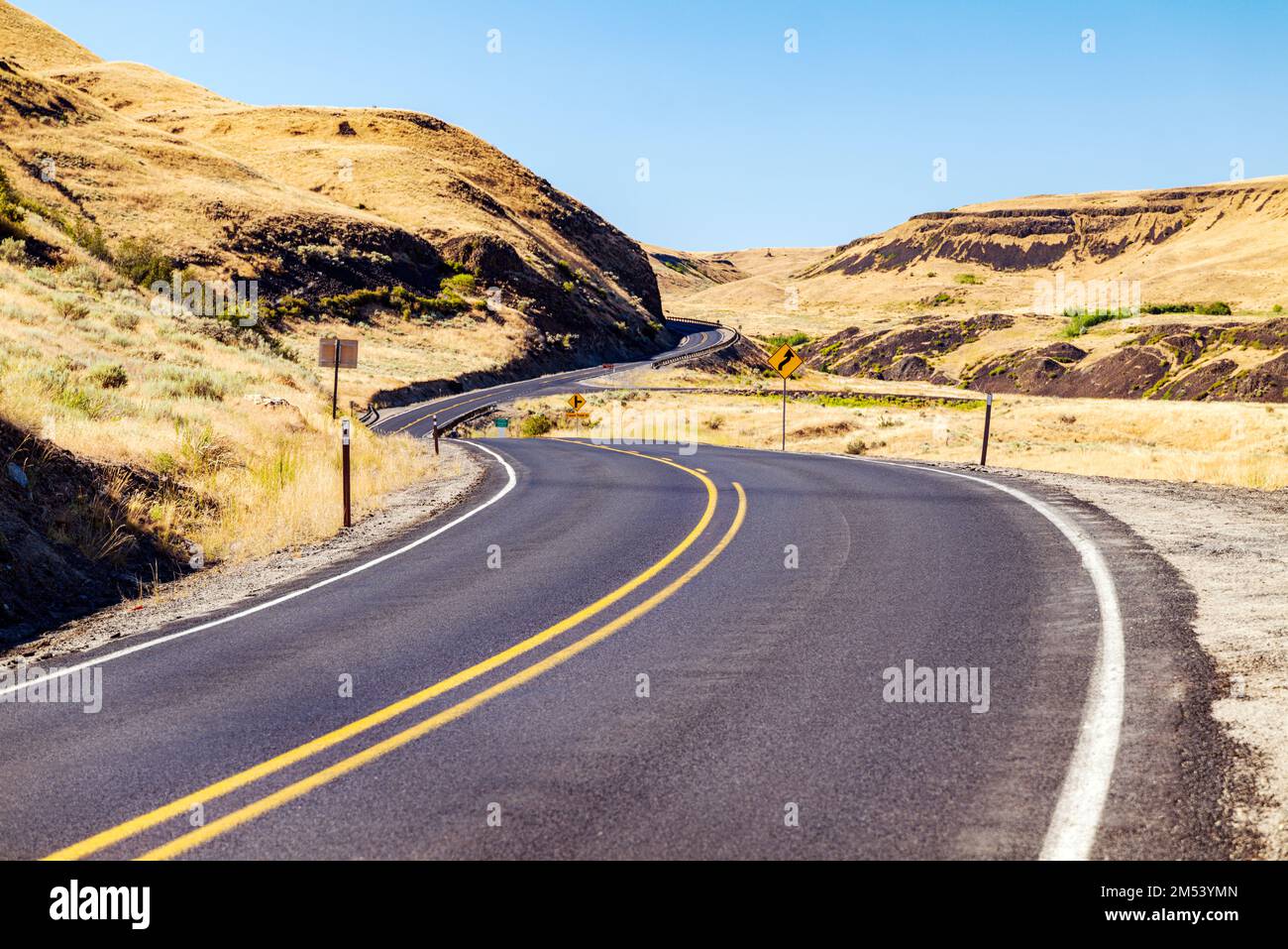 Winding rural road near Grand Coulee; Washington; USA Stock Photo