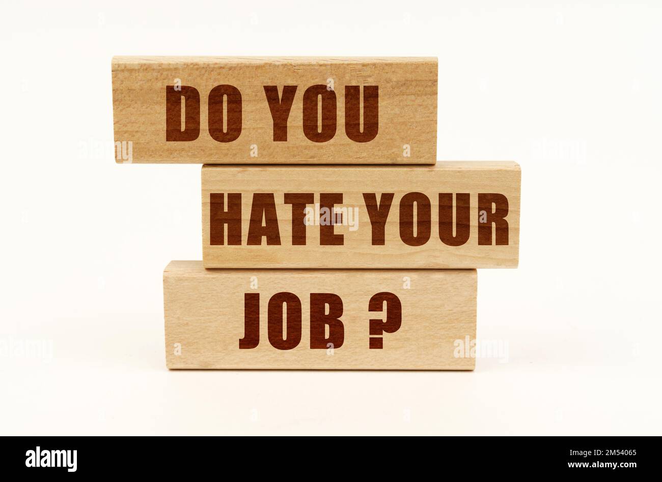 Business concept. On a white surface are wooden blocks with the inscription - DO YOU HATE YOUR JOB Stock Photo