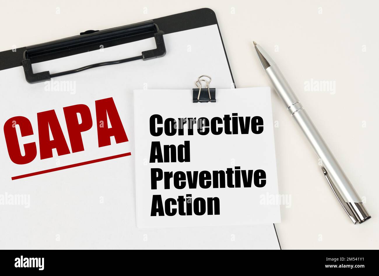Business concept. On the tablet is a sheet of paper with the inscription - CAPA and stickers with the inscription - Corrective And Preventive Action, Stock Photo