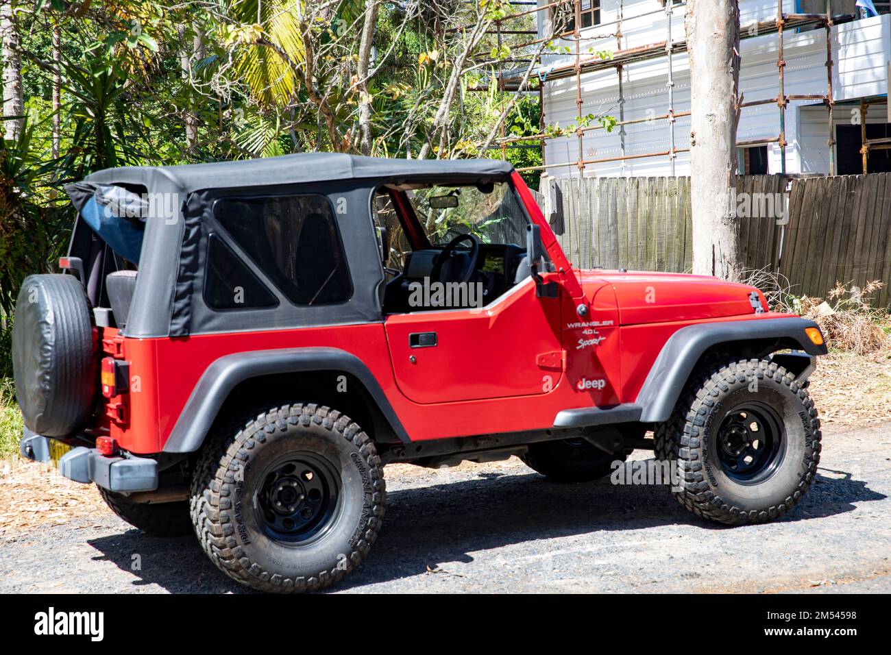 Jeep Wrangler Sport in red, model year 2000, parked in Palm Beach,Sydney,NSW,Australia Stock Photo