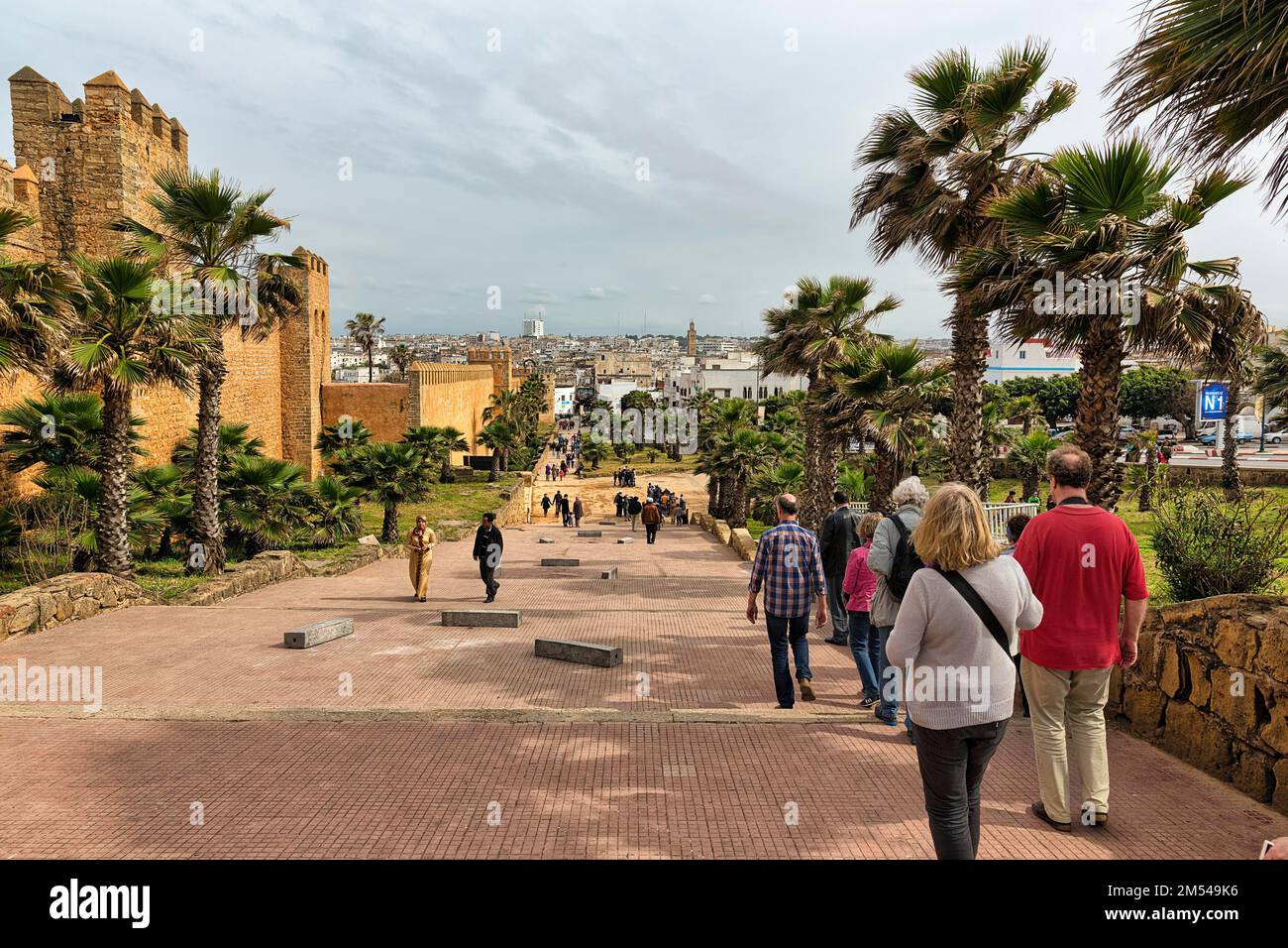 Pedestrians at the Kasbah des Oudaias fortress, view of the city, Rabat
