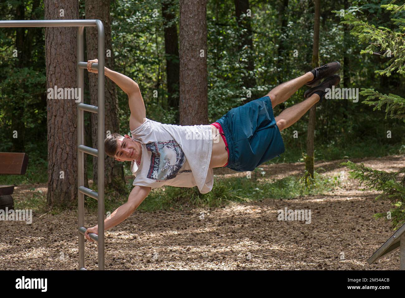 Human Flag, Young Man on a Fitness Course, Bayerm Germany Stock Photo