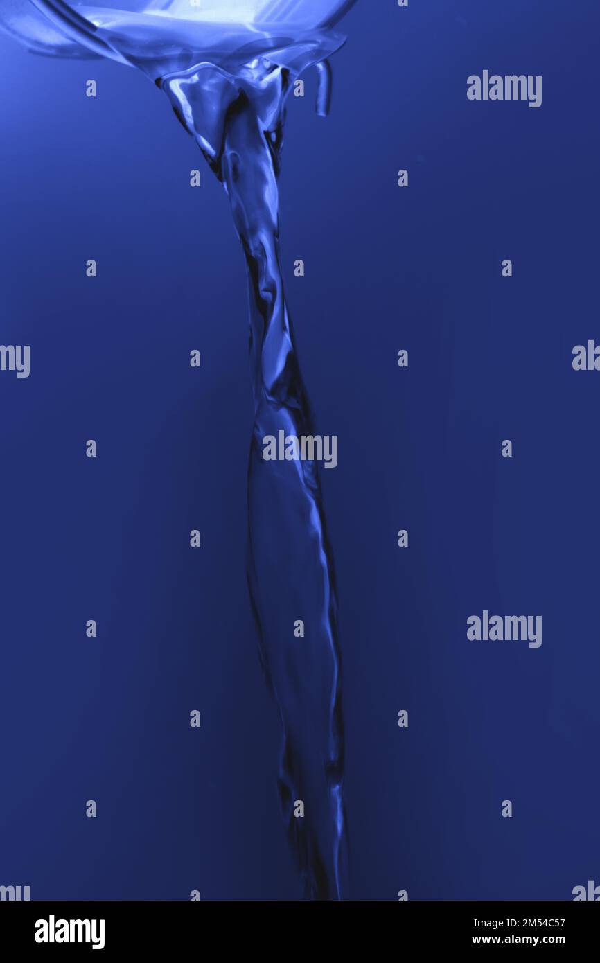 Water flowing out of little yellow bucket Stock Photo Alamy