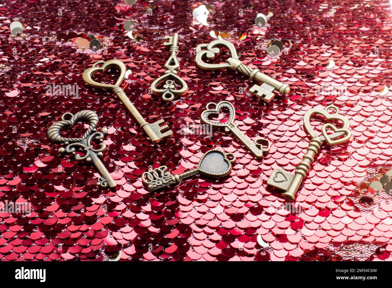 Heart shaped retro metal keys on bright background Stock Photo