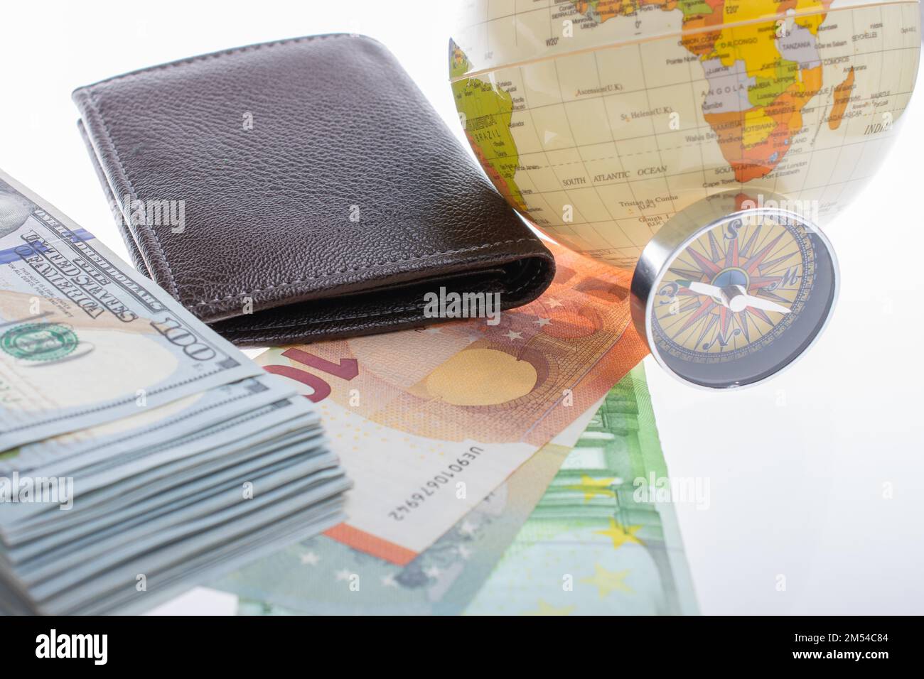 Compass, wallet, Euro banknotes with Euro currency finance direction Stock Photo