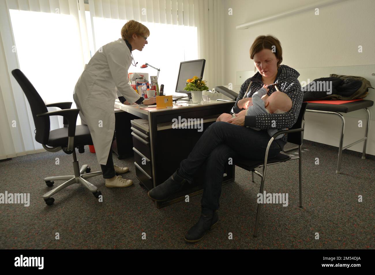 In the family doctor's consultation. Paediatrics, Germany Stock Photo