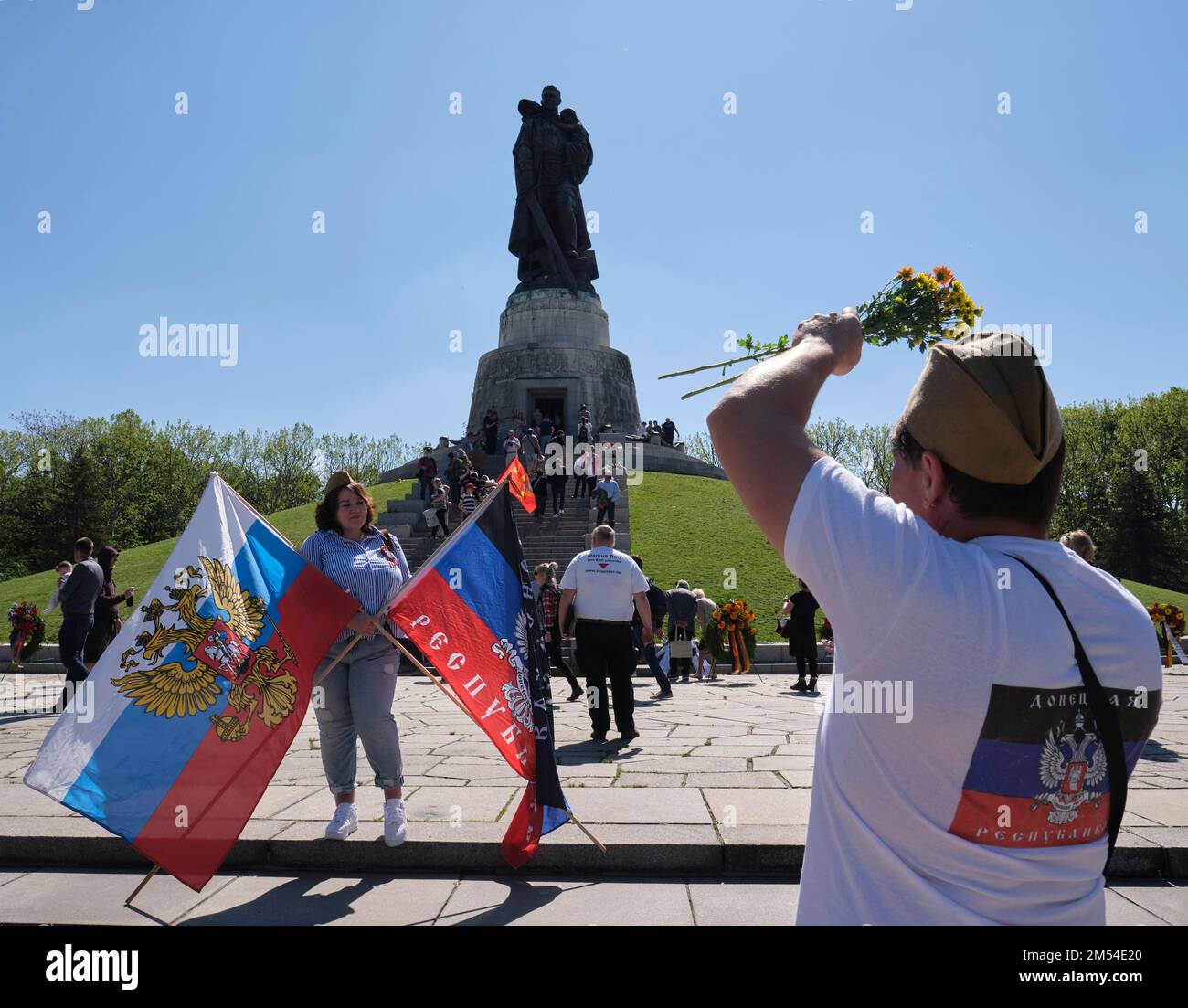 Germany, Berlin, 09. 05. 2020, Victory Day (over Hitler's fascism), Soviet Memorial Berlin-Treptow, woman, flags Stock Photo