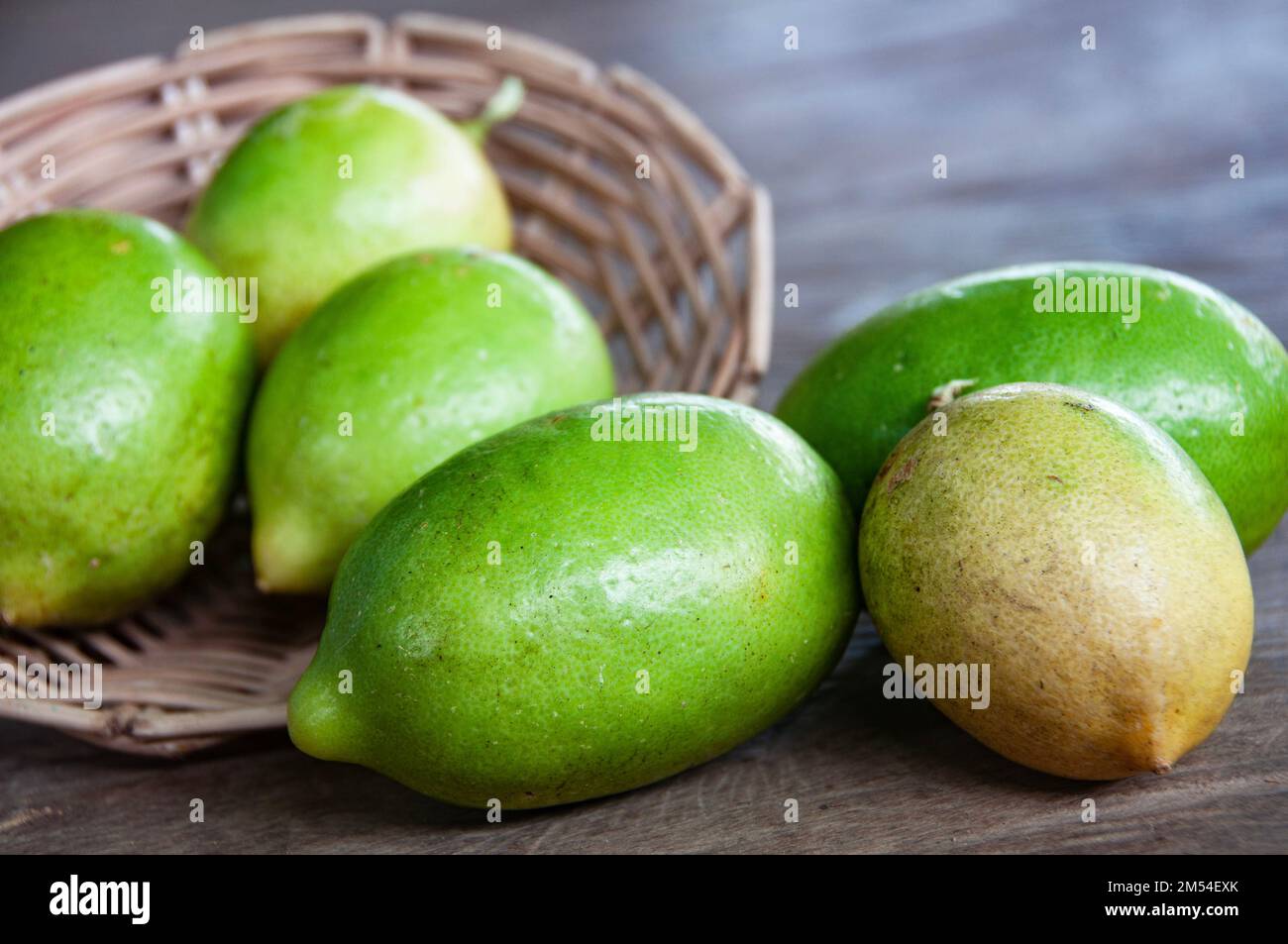 Close up of lemons on wooden basket. Asian food concept Stock Photo