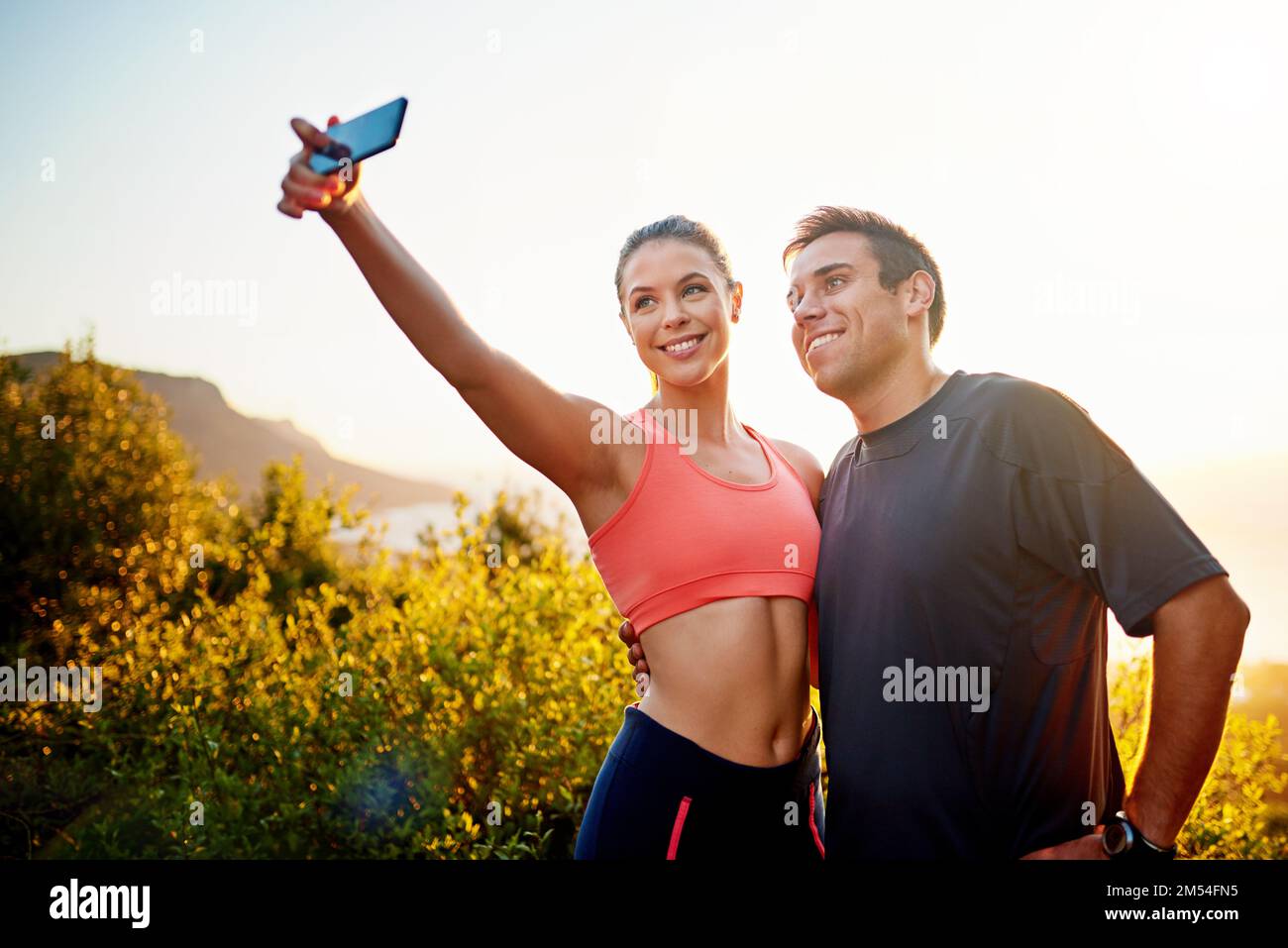 Living the healthy life. a sporty young couple taking a selfie while ...