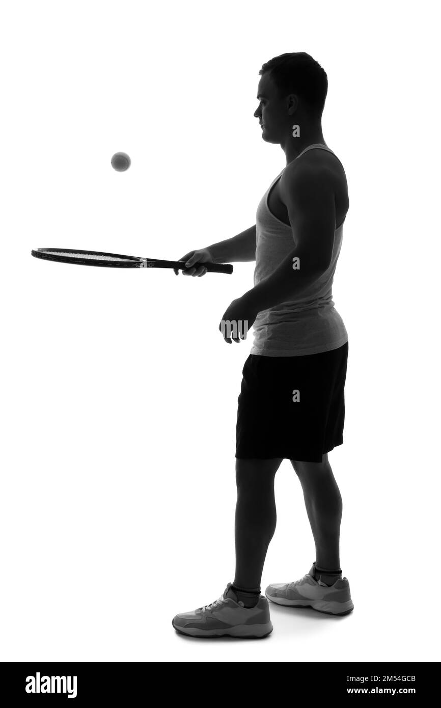Silhouette of young man playing tennis on white background Stock Photo