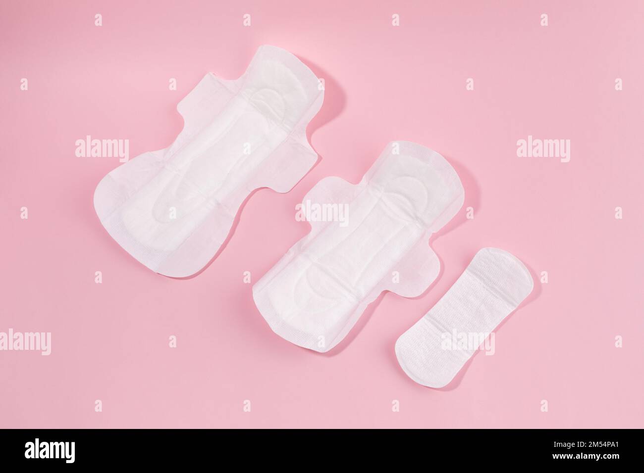 woman menstrual products compare sanitary pad size Stock Photo Alamy