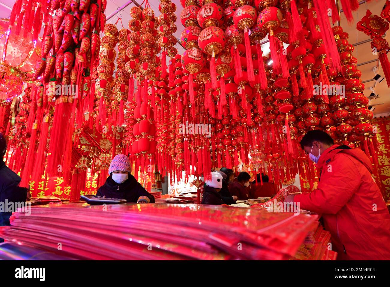 NANTONG, CHINA DECEMBER 26, 2022 People shop for New Year ornaments