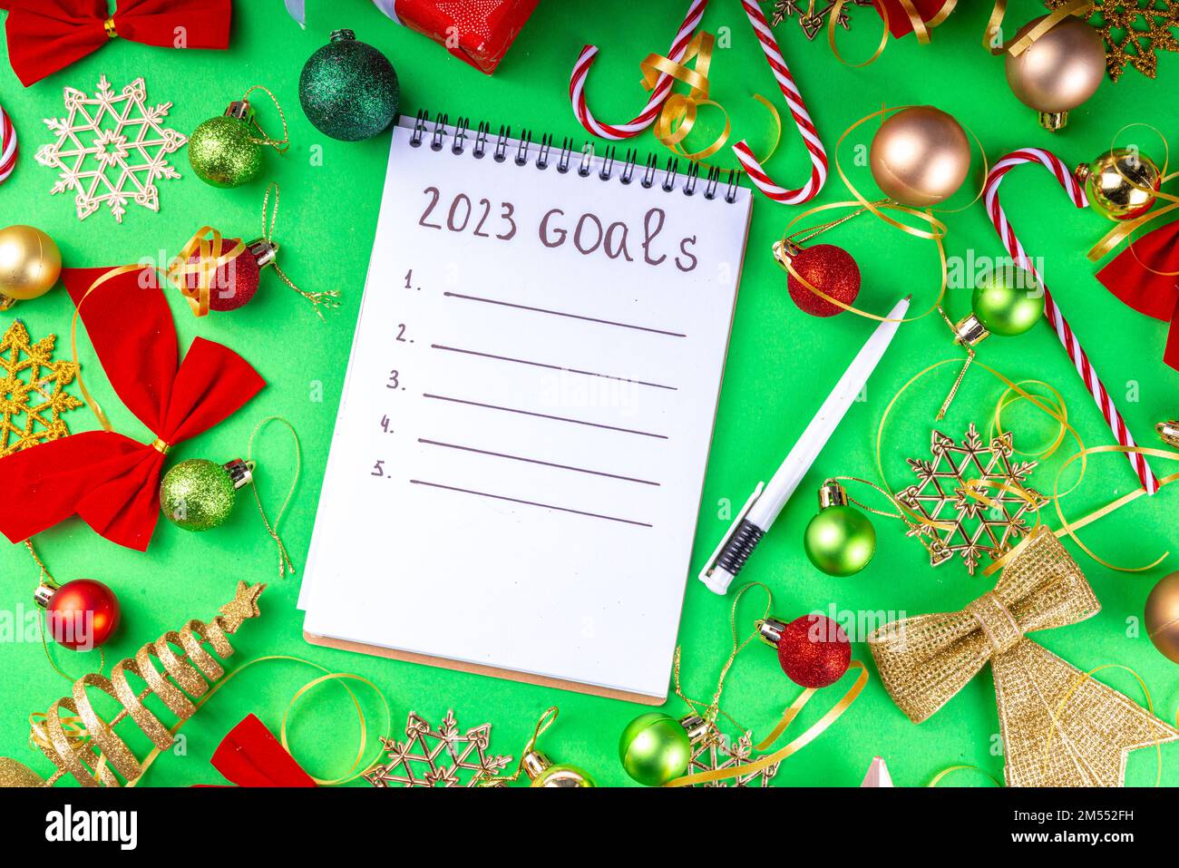 Notebook with New's Year Resolutions massage, with Christmas ornaments