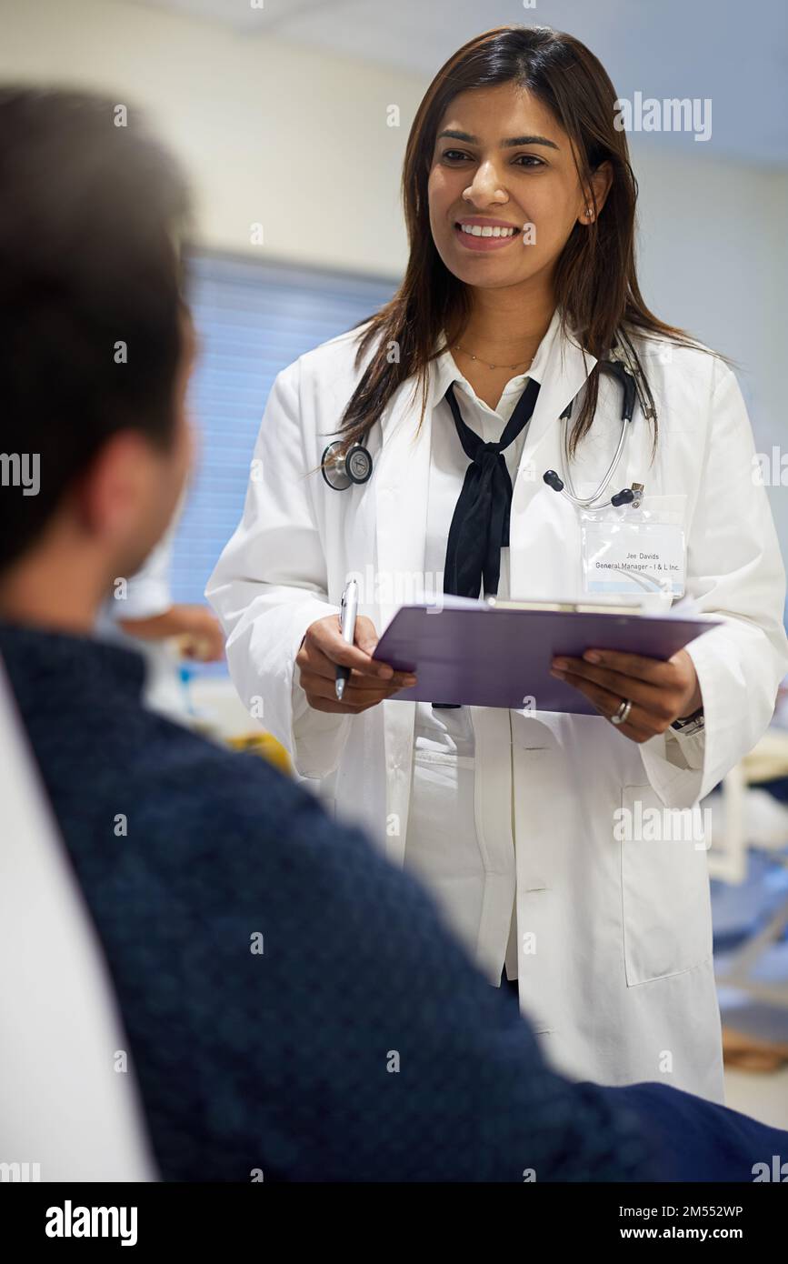 Dedicated to her patients health and wellbeing. a doctor attending to a