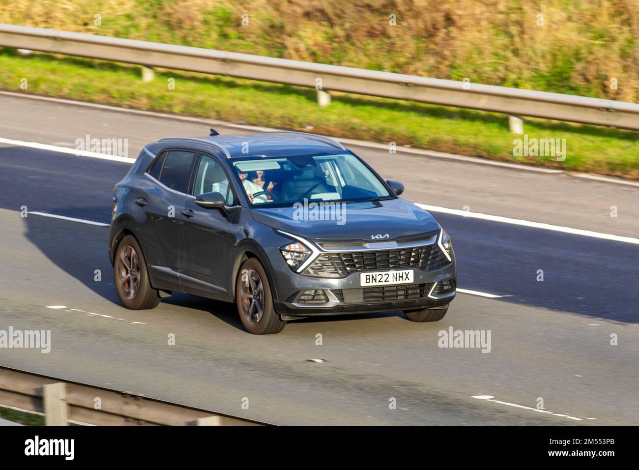 2022 Grey KIA SPORTAGE 3 ISG HEV AUTO 1598cc Electric Petrol vehicle; travelling on the M6 Motorway, Manchester, UK Stock Photo