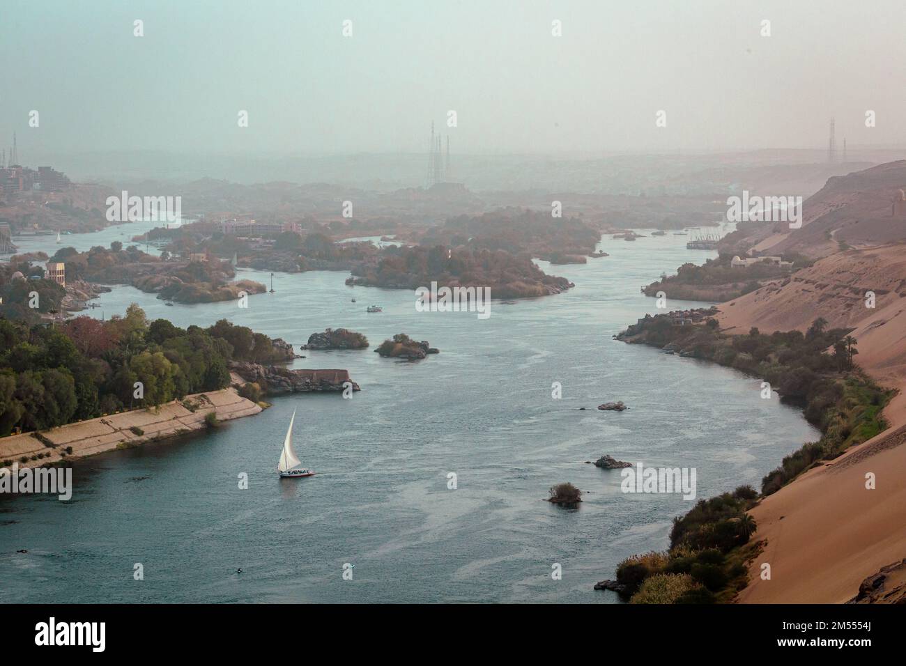 Felucca (river boat) on the Nile, with the Sahara behind in Aswan, Egipt. Stock Photo