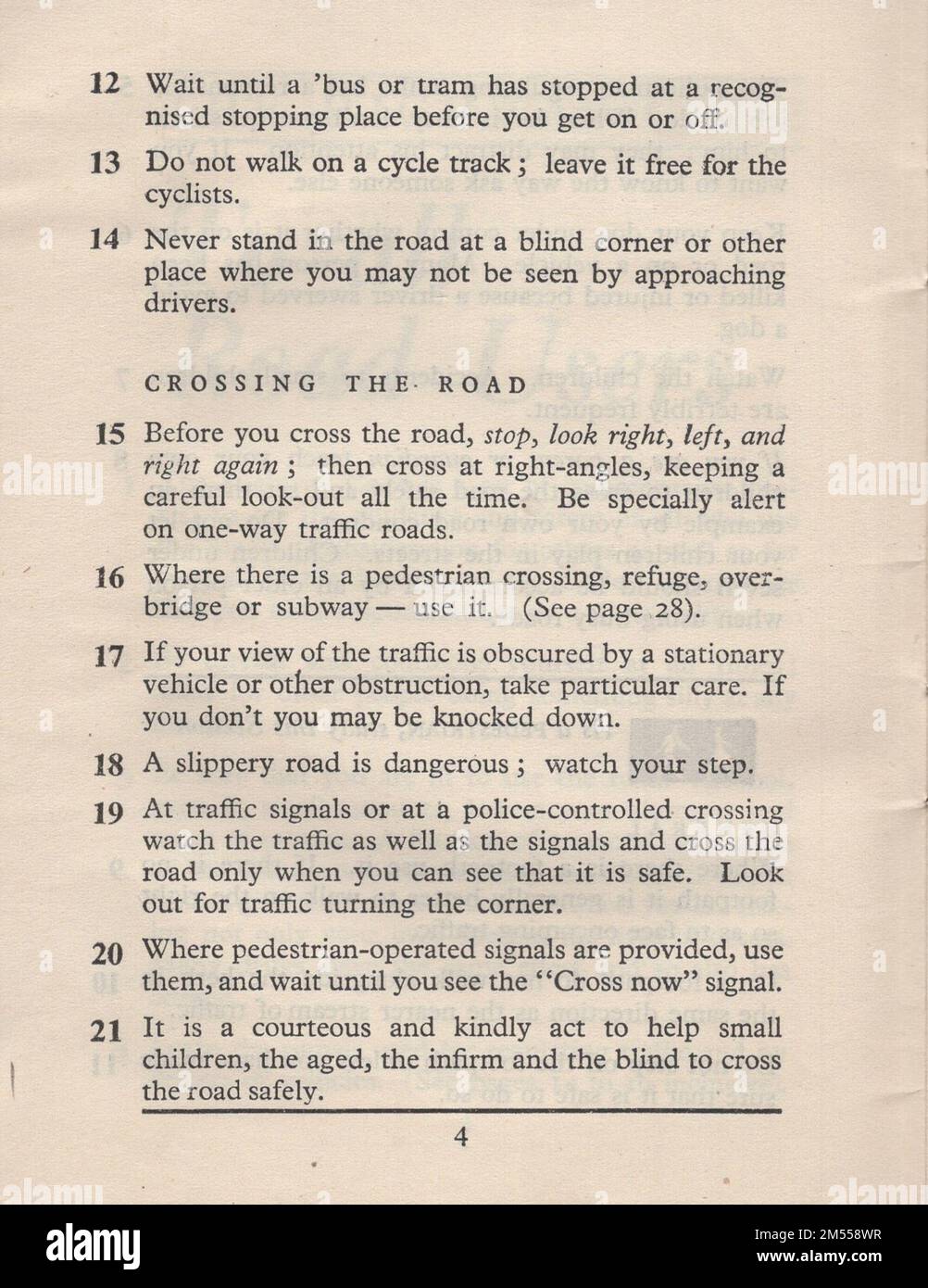 The highway code : Issued by the minister of transport with the authority of parlaiment for the guidance and safety of all road users with an appendix including diagrams of signal and signs. London : published by His Majesty's stationery office. One penny net. To be purchased direct from H.M. Stationery Office at following addresses : York House, Kingsway, London WC2 / 13a castle street Edinburgh 2 / 39-41 King street Manchester 2 / 1st Andrews Crescent Cardiff / 80 Chichester street , Belfast / or through any bookseller. crossing the road Stock Photo
