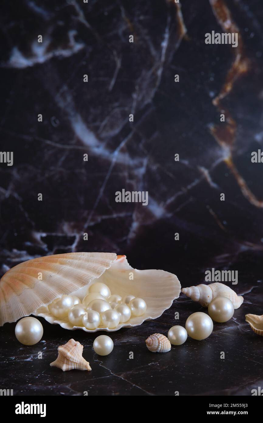 Pearls Containing Shells a few pearls in a sea shell Stock Photo - Alamy