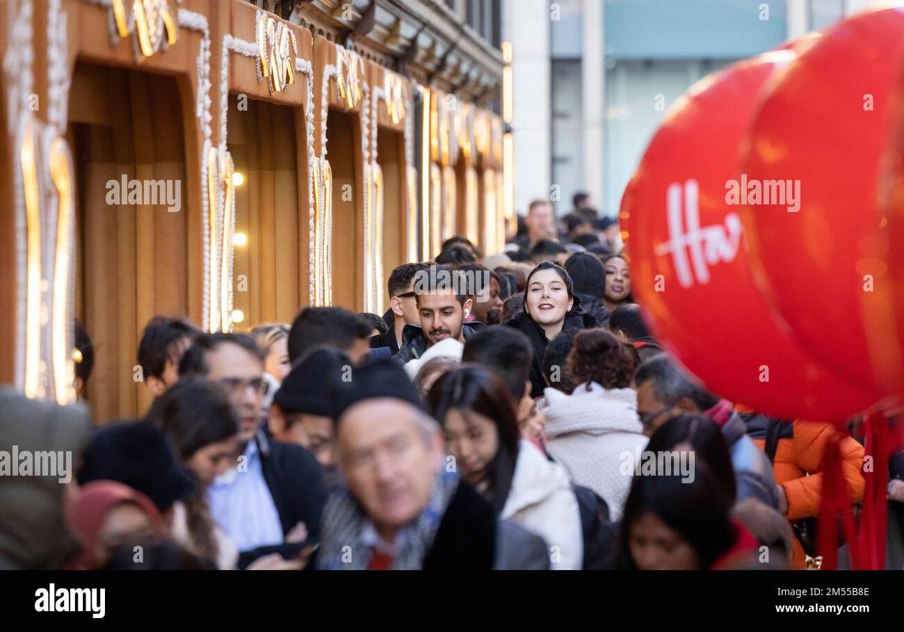 EDITORIAL USE ONLY Customers queue outside Harrods in Knightsbridge